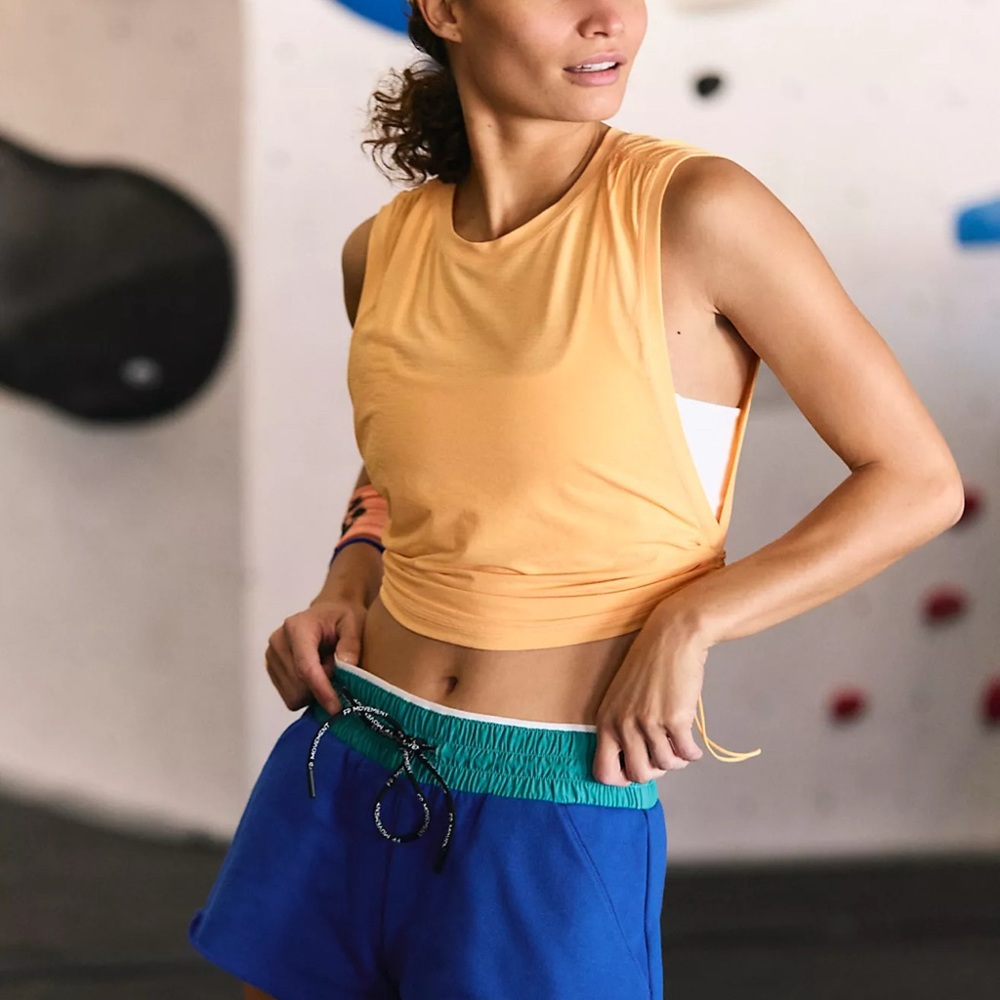 Free People Movement Tempo Sport Mode Muscle Tee in color: Papaya